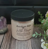 Pink sugar scrub in clear container with black lid