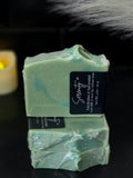 Green with blue swirls soap infused with goat milk and sea clay.