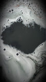 Black bath water with bubbles