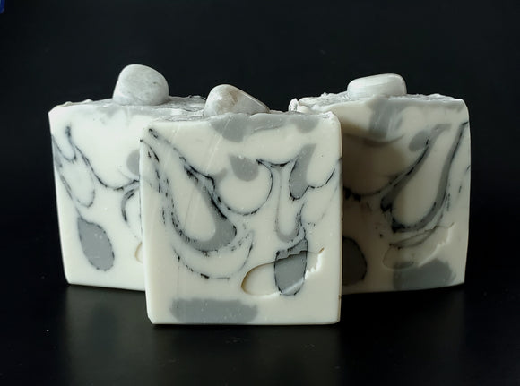 Rainbow Moonstone Soap. White soap with black and grey swirl, moonstone on top
