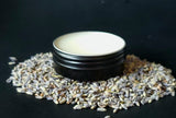 Tattoo balm in  in black tin on lavender buds