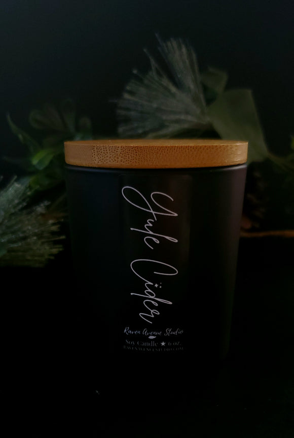 Yule Cider 6 oz candle in black jar with bamboo lid