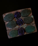 Dark Purple soap bar with gree and lavender swirls, topped with a dark purple soap rose and green soap leaves