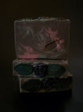 Dark Purple soap bar with gree and lavender swirls, topped with a dark purple soap rose and green soap leaves