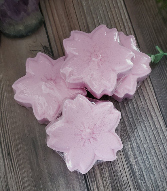 Pink cherry blossom shaped bath fizzy with eco glitter on top.