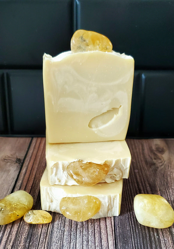 Yellow and white swirled soap with genuine citrine crystal on top