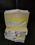 Coconut milk infused soap with rainbow layered jojoba beads throughout the bar.