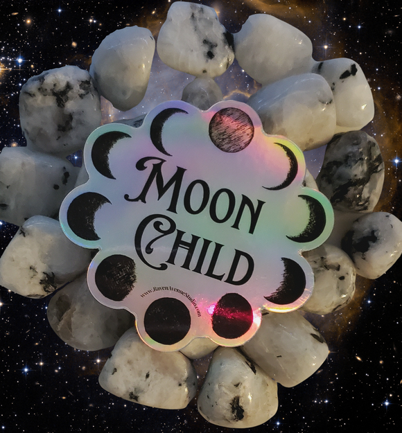 Holographic Sticker with a circle of the moon phases that says Moon Child in black 