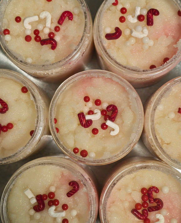 Pink and white sugar scrub with candy cane sprinkles on top