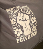 Gray t-shirt with a white fist and floral design, featuring the text 'Fight for those without your privilege'.