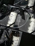 Set of home fragrance products in a clear box with a black bow