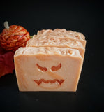 Pumpkin infused artisan soap, orange swirl soap bar with stamped  jack o lantern face