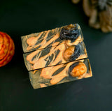 Black bar of soap with pumpkin design 