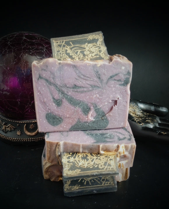 Purple and swirled soap bar with soap tarot card on top