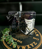 Set of home fragrance products in a clear box with a black bow