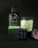 Bath and body products with 'Absinthe' branding on a black background