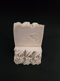 Decorative soap bar with knit texture top on a black background