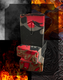 Stack of red and black soap bars with flames and smoke in the background