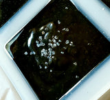 Banish Sea Salt Soap Black with seal salt on top