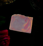 Wanderlust Artisan soap. Purple, gold and pink swirled soap