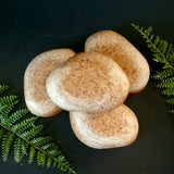 Gardener's Stone scrubbing soap. Tan stone in a rock shape.