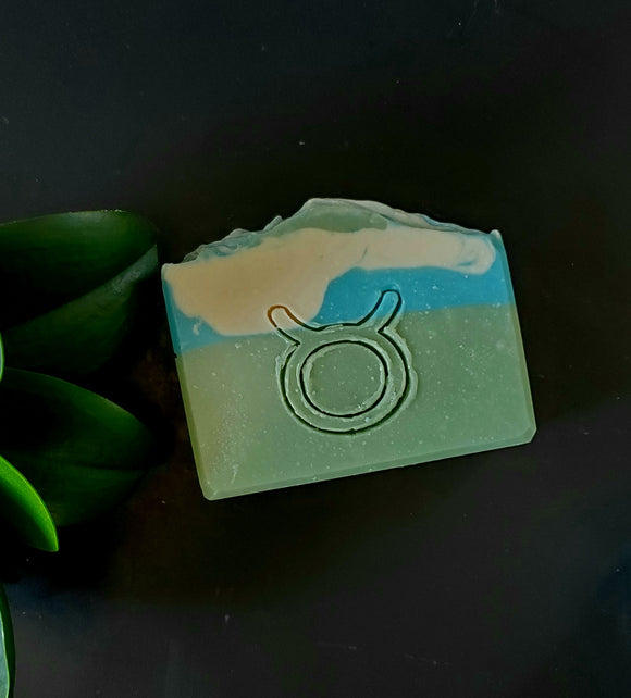 Taurus Astrology Soap. Green, blue and white striped soap with taurus astrology symbol stamped on front
