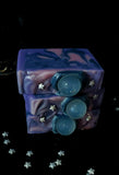 Oracle goat milk soap. Purple soap bar with navy and pink swirls. Clear crystal soap ball on top with silver star sprinkles