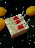 Lunar Lemonade Soap. Red and Yellow ombre with soap pink lemon slices and clear, sparkly stars. Removeable silver glittery straw on top.