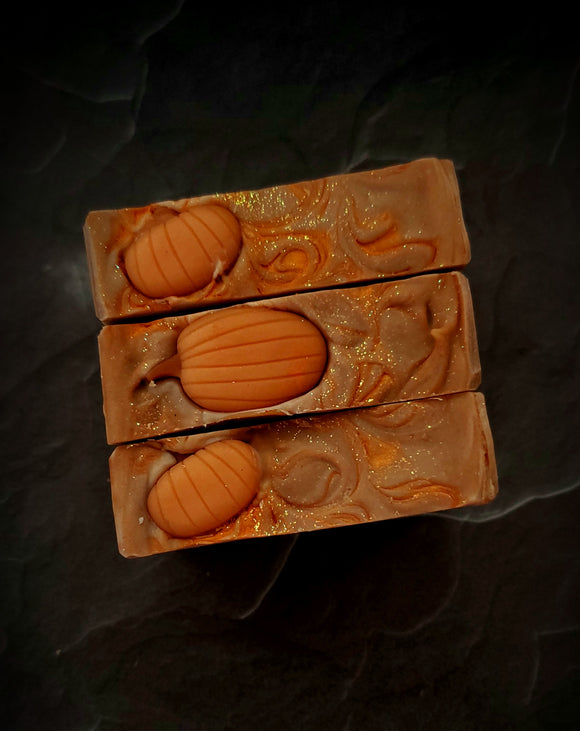 Enchanted Pumpkin artisan soap. Light brown swirled soap with soap pumpkin on top