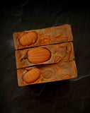 Enchanted Pumpkin artisan soap. Light brown swirled soap with soap pumpkin on top