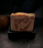 Enchanted Pumpkin artisan soap. Light brown swirled soap with soap pumpkin on top