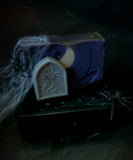 Graveyard artisan soap. Purple and black soap with white crescent moon embed and soap gravestone on the front