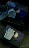 Graveyard artisan soap. Purple and black soap with white crescent moon embed and soap gravestone on the front