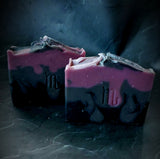 Scorpio Astrology Soap. Black, gray and purple layers with scorpio astrology symbol stamped on the front