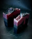Scorpio Astrology Soap. Black, gray and purple layers with scorpio astrology symbol stamped on the front