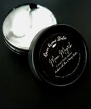Moon Magick Body Butter. Light gray color body butter in black container.