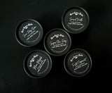 Twisted Peppermint Body butter in black container.