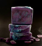 Sagittarius Astrology Soap. Purple soap with black and teal swirls. Sagittarius symbol stamped on front.