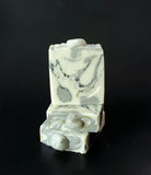 Rainbow Moonstone Soap. White soap with black and grey swirl, moonstone on top