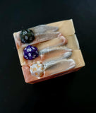 Gold, silver and copper colored soap with a D20 dice on top