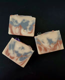 Gold, silver and copper colored soap with a D20 dice on top