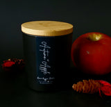 autumn apple soy candle in matte  black jar with bamboo lid