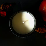 autumn apple soy candle in matte  black jar with bamboo lid