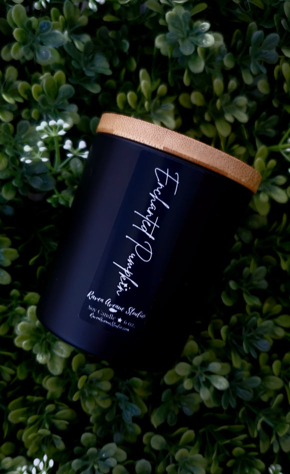 Enchanted pumpkin soy  candle in matte black jar with bamboo lid