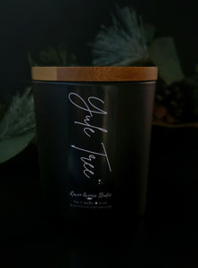 Yule Tree 6 oz candle in black jar with bamboo lid