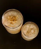 Golden sugar scrub with gold glitter on top.