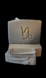 Gray to white ombre soap with Capricorn symbol stamped on the front.