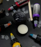 Tattoo balm in  in black tin 1 oz and 1/2 oz size
