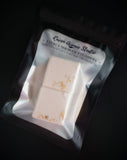 Celestial Citrus shower steamer topped with calendula petals shown in  packaging