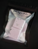 Lavender Moon shower steamer  topped with lavender buds show in packaging